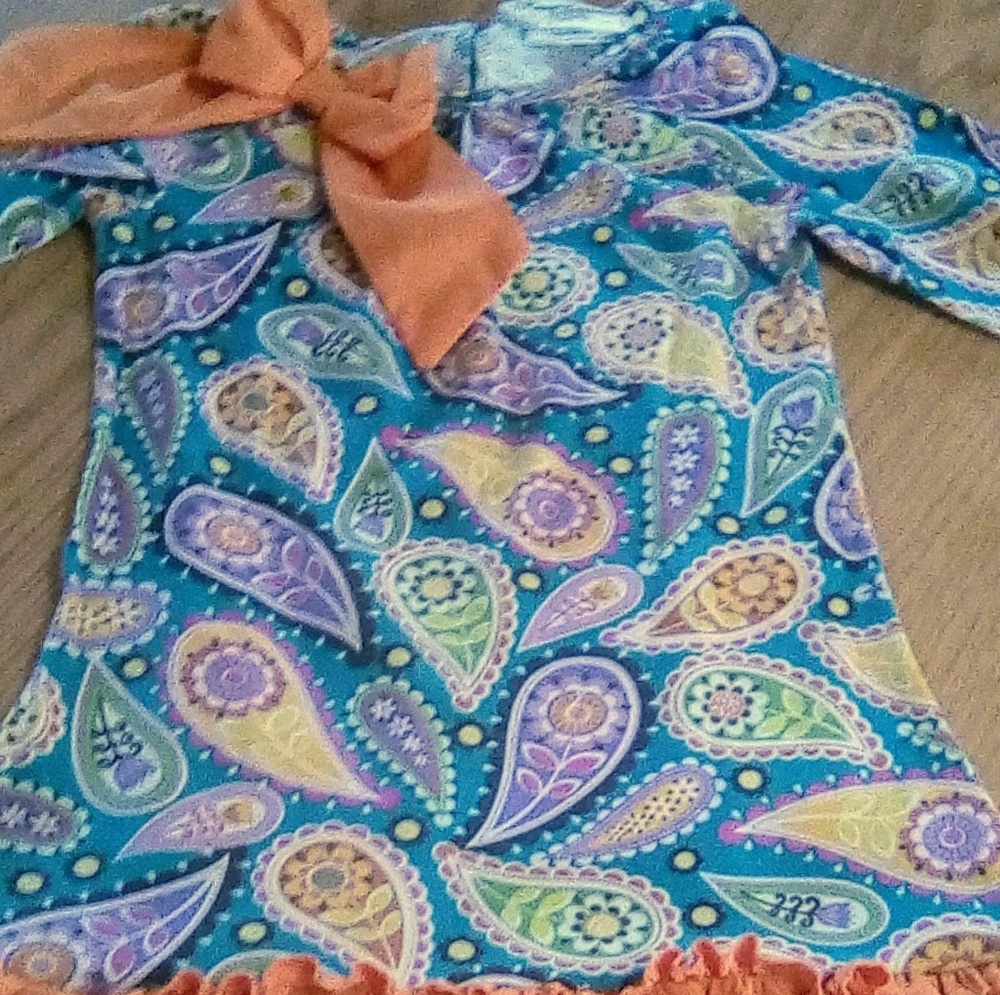 paisley print dress with orange ruffle trim
